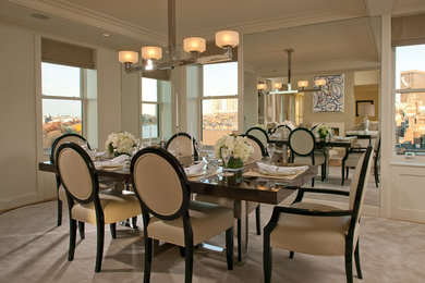 Inspiration for a mid-sized timeless carpeted enclosed dining room remodel in Boston with white walls