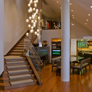 Contemporary Staircase and Entryway to Dining and Kitchen Area