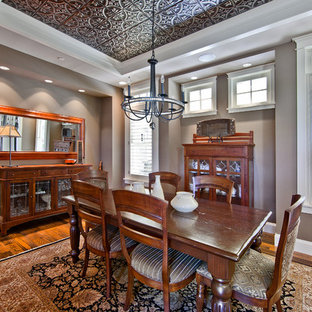 Example of a classic dark wood floor dining room design in Seattle with brown walls