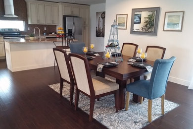 Large classic kitchen/dining room in Orlando with white walls, dark hardwood flooring and no fireplace.