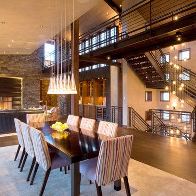 Great room - large contemporary dark wood floor and brown floor great room idea in Denver with beige walls