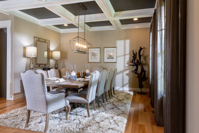 Example of a large classic light wood floor and brown floor kitchen/dining room combo design in Columbus with beige walls