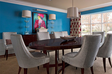 Enclosed dining room - large medium tone wood floor enclosed dining room idea in Detroit with blue walls