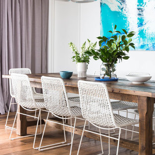 Inspiration for a contemporary dining room in Melbourne with white walls and dark hardwood floors.