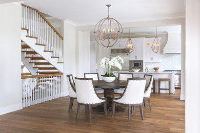 Kitchen/dining room combo - large transitional medium tone wood floor and brown floor kitchen/dining room combo idea in Miami with white walls and no fireplace