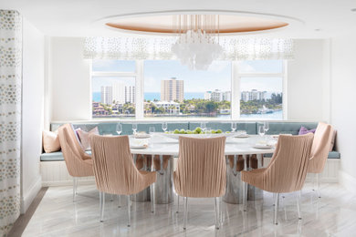 Example of a transitional multicolored floor and tray ceiling breakfast nook design in Miami with white walls and no fireplace
