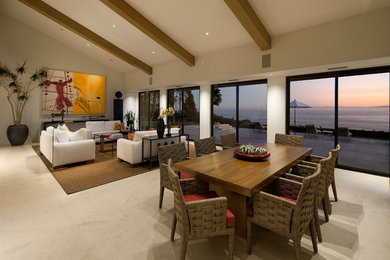 Example of a trendy great room design in Santa Barbara with beige walls and no fireplace