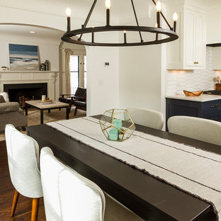 Foto de comedor de cocina clásico renovado, de tamaño medio, con paredes blancas, suelo de madera oscura, todas las chimeneas, marco de chimenea de madera y suelo marrón