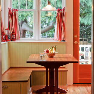 Example of a mid-sized arts and crafts light wood floor dining room design in Seattle