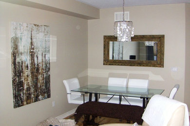 Example of a minimalist dining room design in Calgary