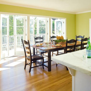 Example of a mid-sized classic medium tone wood floor kitchen/dining room combo design in San Francisco with green walls