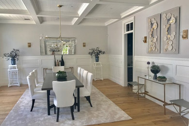 Inspiration for a large contemporary light wood floor and beige floor great room remodel in Los Angeles with gray walls and no fireplace