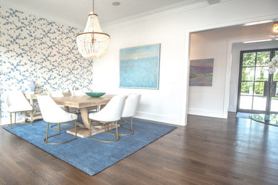 Large transitional dark wood floor dining room photo in New York with white walls