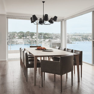 Photo of a large contemporary kitchen/dining combo in Sydney with light hardwood floors.