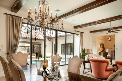 Photo of a medium sized traditional open plan dining room in Orlando with beige walls.