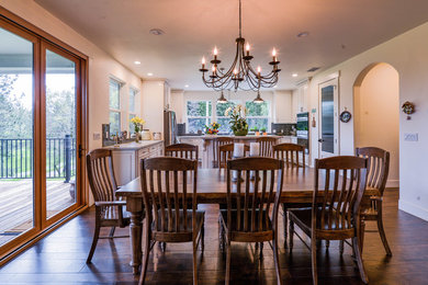 Inspiration for a mid-sized timeless dark wood floor and brown floor great room remodel in Sacramento with white walls