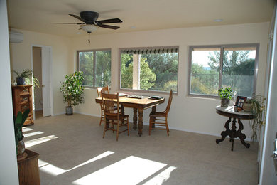 Mid-sized elegant carpeted and gray floor enclosed dining room photo in Phoenix with white walls and no fireplace