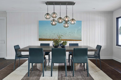 Example of a transitional dark wood floor, brown floor and shiplap wall dining room design in Denver with white walls