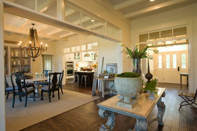 Inspiration for a large classic kitchen/dining room in Charleston with white walls, dark hardwood flooring and no fireplace.
