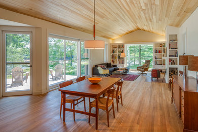 Inspiration for a cottage medium tone wood floor great room remodel in Portland Maine
