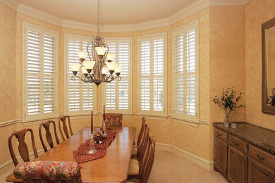 Mid-sized elegant carpeted and beige floor enclosed dining room photo in Dallas with beige walls and no fireplace