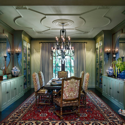 Example of a large tuscan dark wood floor enclosed dining room design in Denver with green walls and no fireplace