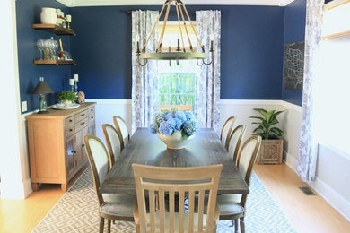 Design ideas for a large traditional enclosed dining room in Bridgeport with blue walls, light hardwood flooring, no fireplace and brown floors.