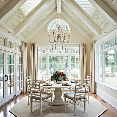 French country dark wood floor and brown floor dining room photo in Charlotte with beige walls