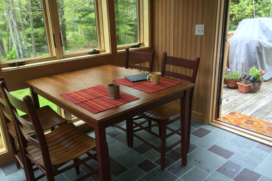 Medium sized traditional enclosed dining room in Phoenix with brown walls, ceramic flooring, no fireplace and multi-coloured floors.