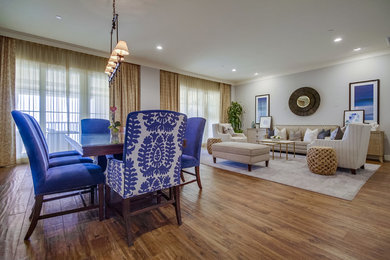 Large transitional medium tone wood floor great room photo in San Diego with gray walls