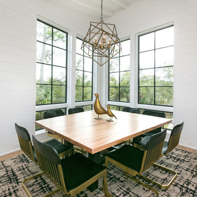 Trendy medium tone wood floor enclosed dining room photo in Charleston with white walls and no fireplace