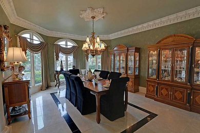 Example of a tuscan porcelain tile dining room design in Atlanta with green walls