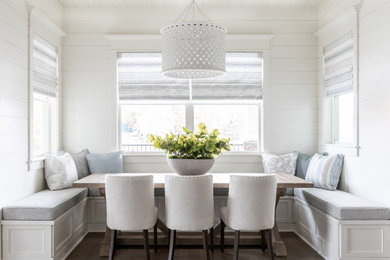 Dining room - coastal dark wood floor, brown floor and shiplap wall dining room idea in Charlotte with white walls