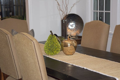 Enclosed dining room - traditional enclosed dining room idea in New York with white walls