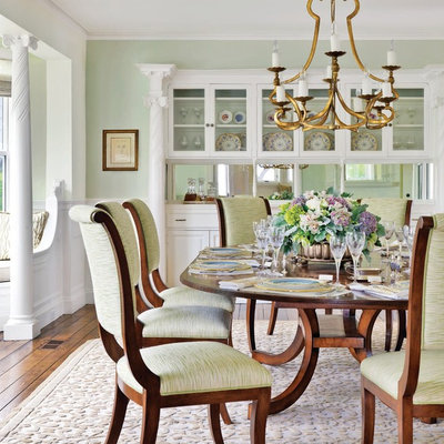 Large beach style dark wood floor enclosed dining room photo in Boston with green walls and no fireplace