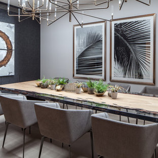 Design ideas for a contemporary dining room in London with black walls, no fireplace and beige floors.