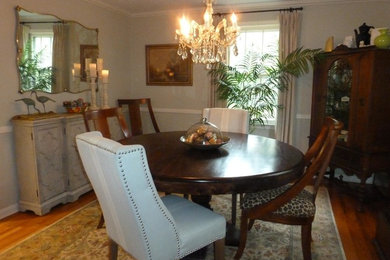 Enclosed dining room - mid-sized transitional medium tone wood floor enclosed dining room idea in Philadelphia with blue walls and no fireplace