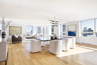 Great room - large contemporary light wood floor great room idea in New York with white walls