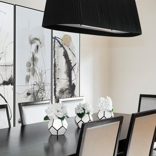 Contemporary dining room in Other with beige walls and no fireplace.