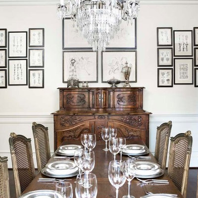 Enclosed dining room - large traditional dark wood floor enclosed dining room idea in Other with white walls