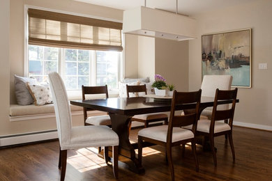 Example of a mid-sized transitional medium tone wood floor and brown floor kitchen/dining room combo design in Baltimore with brown walls and no fireplace