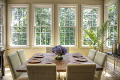 Dining room - transitional dining room idea in Charlotte with beige walls