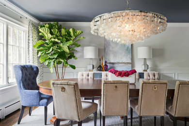 Dining room - transitional dark wood floor and brown floor dining room idea in New York with white walls