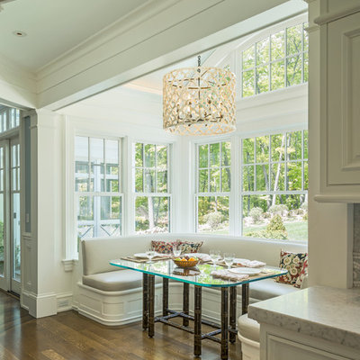 Kitchen/dining room combo - traditional medium tone wood floor and brown floor kitchen/dining room combo idea in Boston with white walls
