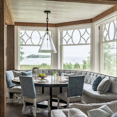 Inspiration for a small coastal dark wood floor great room remodel in Other with white walls and no fireplace