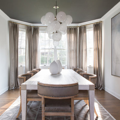Enclosed dining room - transitional medium tone wood floor and brown floor enclosed dining room idea in Philadelphia with beige walls