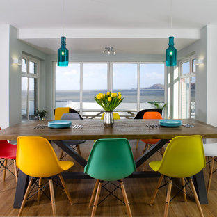 Design ideas for a medium sized contemporary dining room in Other with white walls, light hardwood flooring and beige floors.