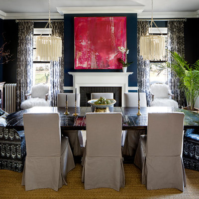 Example of a tuscan dark wood floor dining room design in Baltimore with blue walls and a standard fireplace