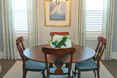 Example of a transitional dining room design in Jacksonville with gray walls