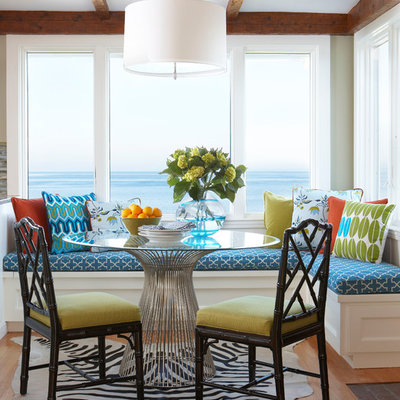 Example of a mid-sized beach style medium tone wood floor kitchen/dining room combo design in Boston with beige walls and no fireplace